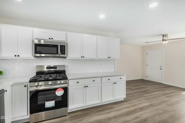 kitchen with ceiling fan, tasteful backsplash, light hardwood / wood-style flooring, appliances with stainless steel finishes, and white cabinets