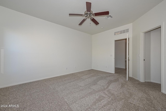 unfurnished bedroom with ceiling fan and carpet