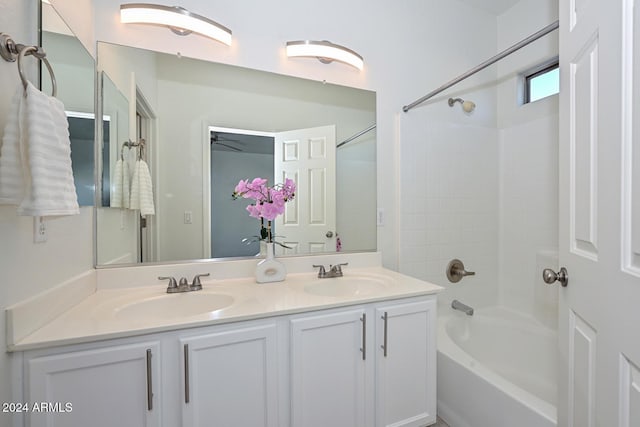 bathroom featuring bathtub / shower combination and vanity