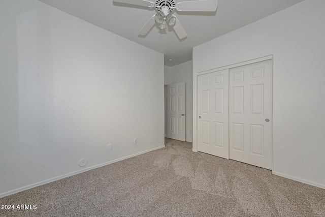 unfurnished bedroom featuring a closet, ceiling fan, and carpet floors