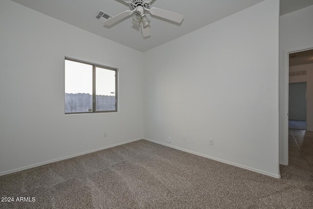 carpeted empty room featuring ceiling fan