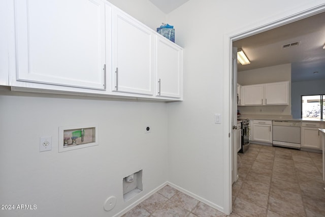 washroom featuring hookup for an electric dryer, hookup for a washing machine, light tile patterned floors, and hookup for a gas dryer