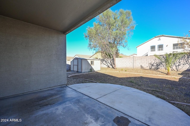 view of patio / terrace featuring a storage unit