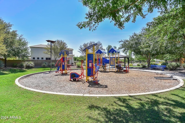 view of playground featuring a lawn