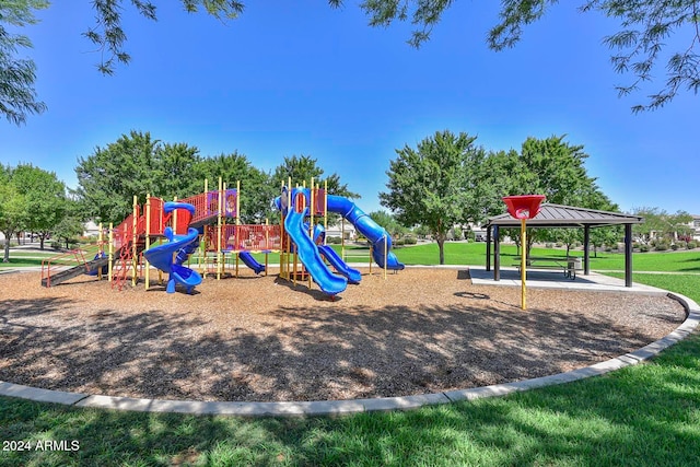 view of playground with a gazebo and a lawn