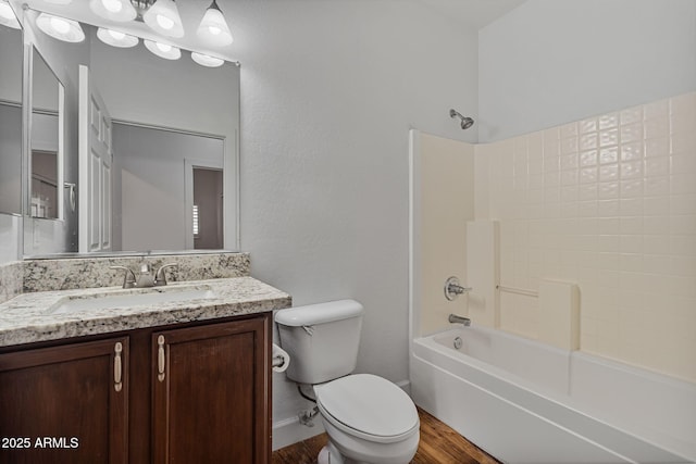 full bathroom with shower / bathing tub combination, vanity, toilet, and hardwood / wood-style floors