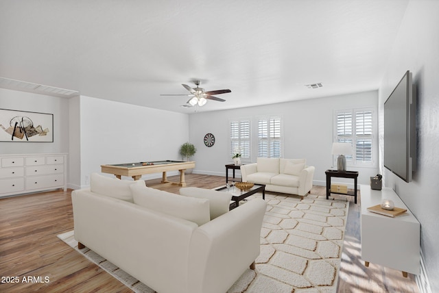 living room featuring ceiling fan, billiards, and light hardwood / wood-style flooring