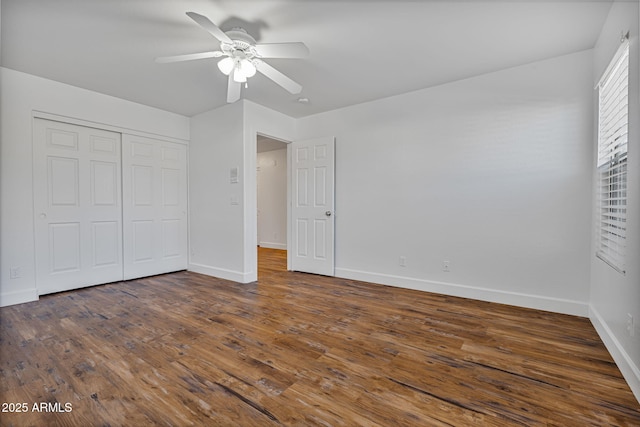 unfurnished bedroom with a closet, ceiling fan, and dark wood-type flooring