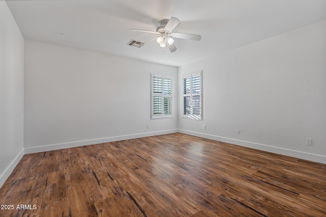 spare room with hardwood / wood-style floors and ceiling fan