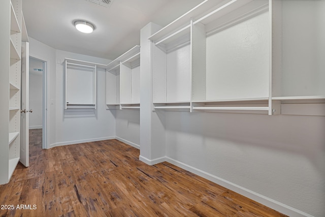 walk in closet featuring wood-type flooring