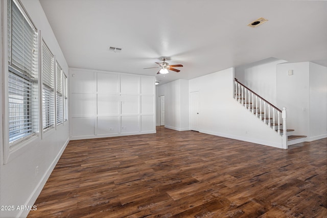 unfurnished living room with ceiling fan and dark hardwood / wood-style floors