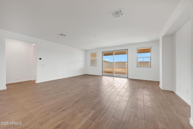 14789 W Lariat Ln, Surprise, AZ 85387 - spare room with light wood-type flooring and baseboards