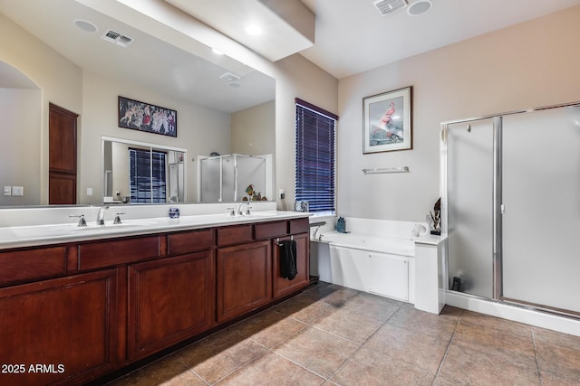 bathroom with vanity, tile patterned floors, and separate shower and tub