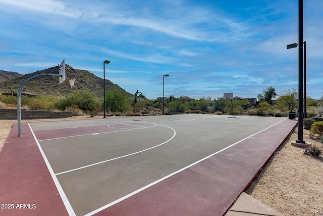 view of basketball court with a mountain view