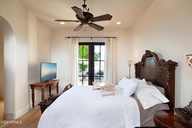 bedroom featuring access to exterior, ceiling fan, french doors, and light hardwood / wood-style floors