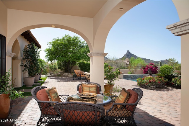 view of patio / terrace with a mountain view