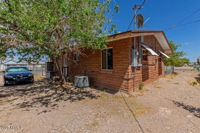 view of home's exterior featuring fence
