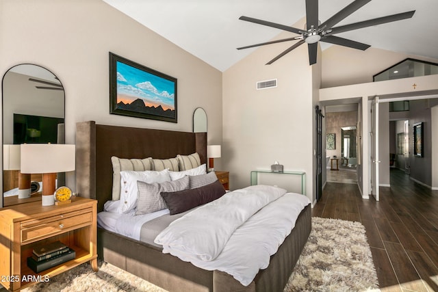 bedroom featuring vaulted ceiling, ceiling fan, and dark hardwood / wood-style flooring