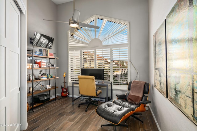 office area featuring dark hardwood / wood-style floors and ceiling fan