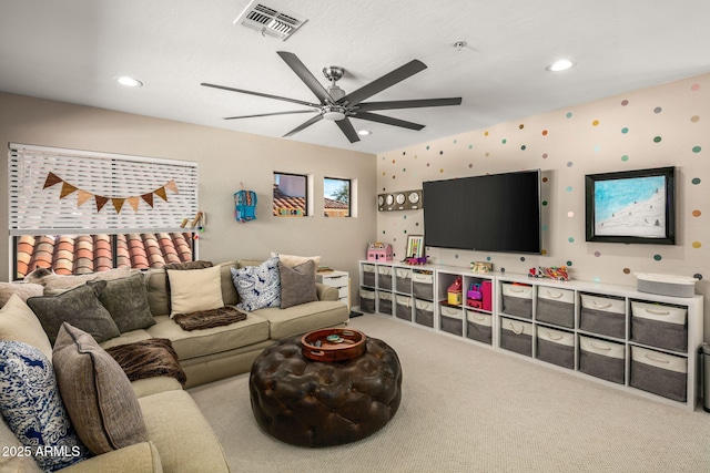 living room featuring ceiling fan and carpet flooring