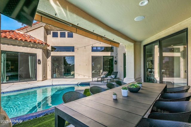 view of pool with a patio