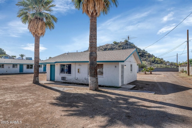721 W Cinnabar Ave, Phoenix, AZ 85021 - view of front facade with stucco siding, driveway, fence, and roof with shingles