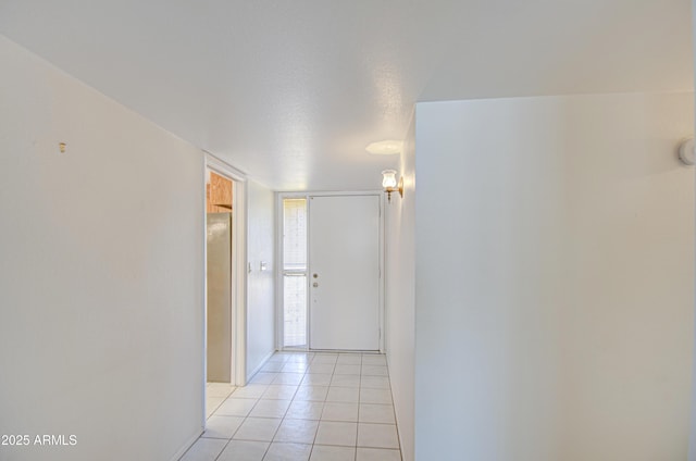 hallway featuring light tile patterned floors