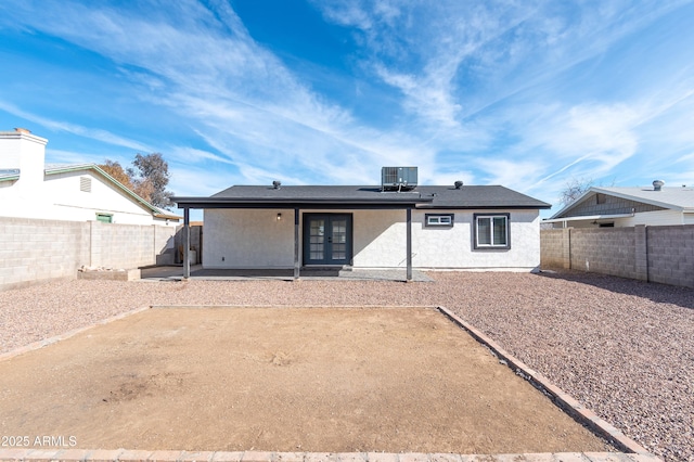 back of house featuring central AC unit, a patio, and french doors