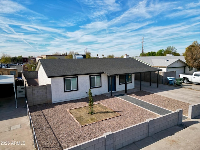 ranch-style house featuring a carport