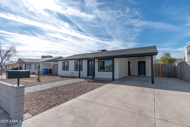 single story home featuring a carport