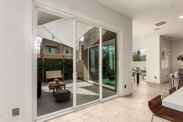 doorway featuring visible vents, recessed lighting, and baseboards