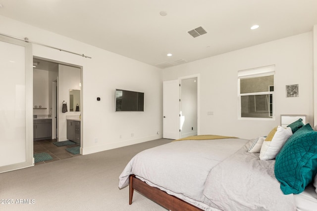 bedroom with visible vents, baseboards, carpet floors, recessed lighting, and ensuite bath