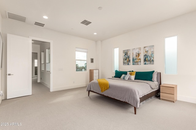 bedroom featuring recessed lighting, visible vents, and light colored carpet