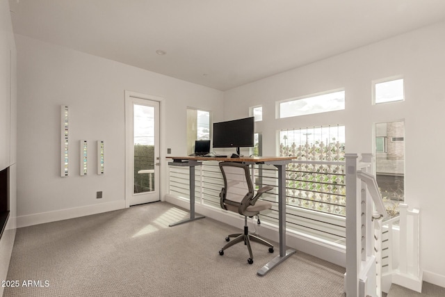 carpeted office featuring baseboards