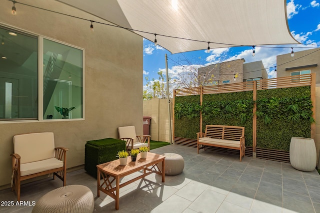 view of patio / terrace with fence