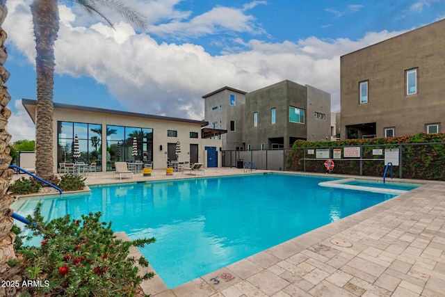 pool featuring a patio and fence