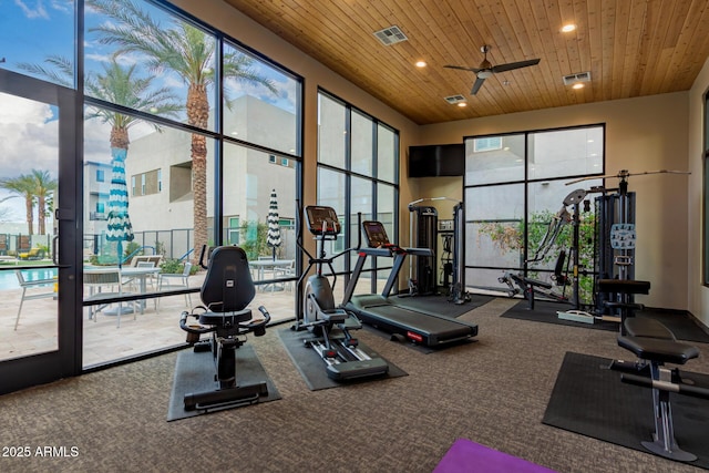 workout area with a ceiling fan, recessed lighting, wood ceiling, and visible vents