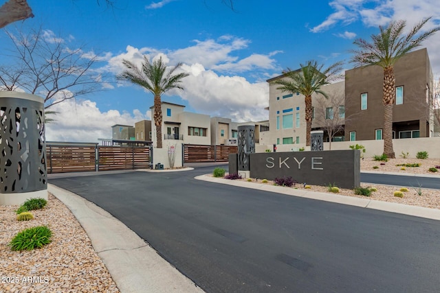 view of road featuring a gate and a residential view