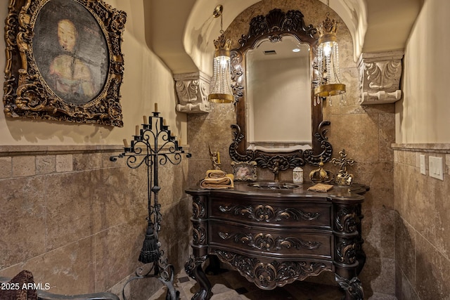 10894 E Turquoise Ave, Scottsdale, AZ 85259 - bathroom with a wainscoted wall, tile walls, and vanity
