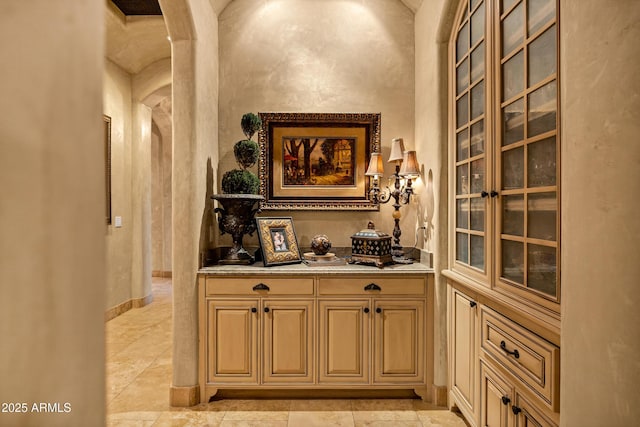 10894 E Turquoise Ave, Scottsdale, AZ 85259 - bar with baseboards and arched walkways