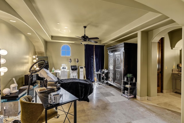 10894 E Turquoise Ave, Scottsdale, AZ 85259 - living room featuring arched walkways, baseboards, a raised ceiling, and ceiling fan