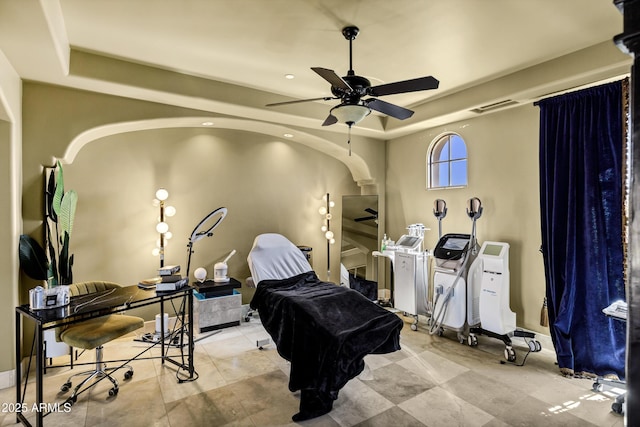 10894 E Turquoise Ave, Scottsdale, AZ 85259 - interior space featuring a ceiling fan, visible vents, baseboards, arched walkways, and a raised ceiling