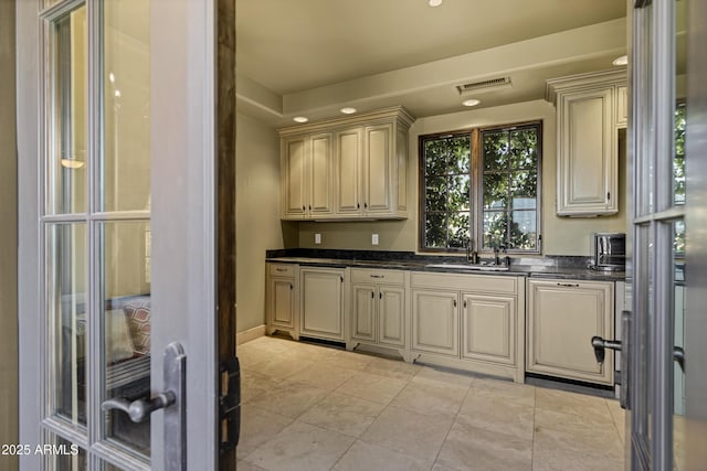 10894 E Turquoise Ave, Scottsdale, AZ 85259 - kitchen with a sink, visible vents, cream cabinets, and light tile patterned flooring