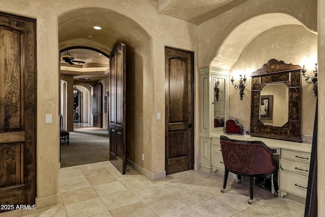 10894 E Turquoise Ave, Scottsdale, AZ 85259 - interior space with arched walkways, baseboards, and light tile patterned flooring