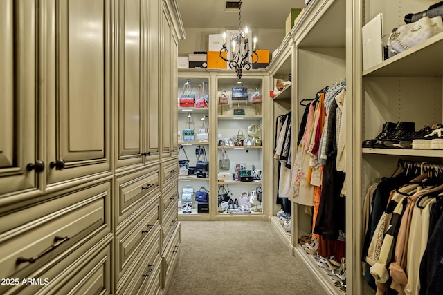 10894 E Turquoise Ave, Scottsdale, AZ 85259 - walk in closet with a chandelier and carpet flooring