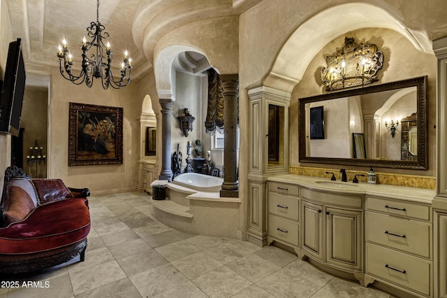 10894 E Turquoise Ave, Scottsdale, AZ 85259 - full bathroom with a bath, a chandelier, and ornate columns