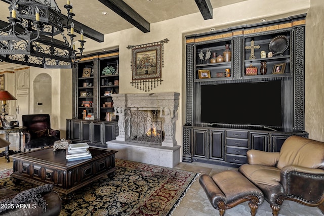 10894 E Turquoise Ave, Scottsdale, AZ 85259 - living area with beamed ceiling, built in shelves, and a premium fireplace