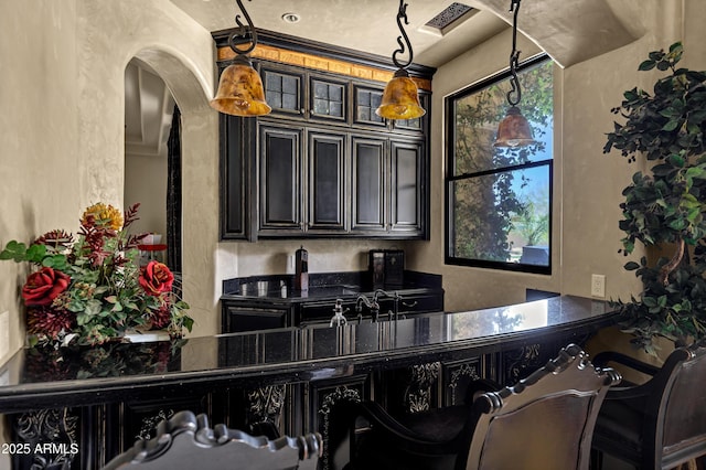 10894 E Turquoise Ave, Scottsdale, AZ 85259 - bar with decorative light fixtures, visible vents, and arched walkways