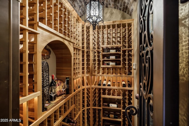 10894 E Turquoise Ave, Scottsdale, AZ 85259 - wine area with brick ceiling, an inviting chandelier, and vaulted ceiling