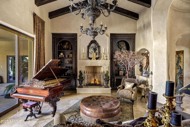 10894 E Turquoise Ave, Scottsdale, AZ 85259 - living room featuring beam ceiling, built in shelves, high vaulted ceiling, and an inviting chandelier